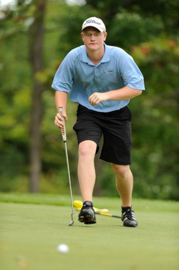 Oceanside's Nick Mazurek checks out a putt on the third hole of the par 37 Rockland Golf Club Tuesday, Aug. 28 during the match with Gardiner. Oceanside won 6-3. Photo by Ron Hawkes
