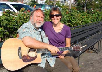 Marta Koonz and her husband, Danny Quinn, on a bench in Camden Harbor Wednesday morning.