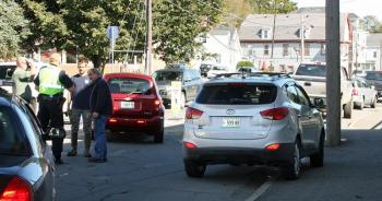 Despite being on vacation, Rockland Deputy Police Chief Wally Tower, far right, was on the scene of the crash on Camden Street Thursday morning.
