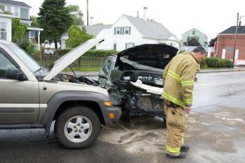 Rockland firefighter Jamie Leo at the scene on Saturday's accident on South Main Street. (Photo courtesy Steve Waterman)
