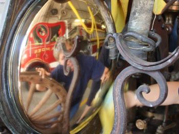 Results of polishing are soon seen on the shiny bits of Camden's antique steam fire pumper.