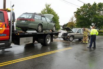 Both cars, totaled, are towed away from South Main Street in Rockland Saturday. (Photo courtesy Steve Waterman)