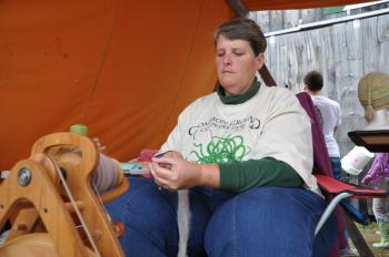 Kim McArthur, of the Western Maine Rabbit Breeders Association, spins Angora fiber. McArthur and the breeders were celebrating their fourth year at Common Ground.