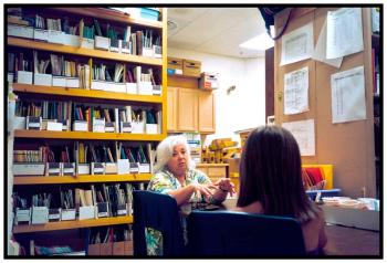 BELFAST – Librarian Sea Chauvin talks with a student in a the storage room of the Captain Albert Stevens School library during a schoolwide lockout, called after an unknown truck appeared twice outside the school. It was the first such incident of the year.