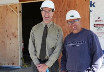 Knox County Administrator Andrew Hart stands outside 301 Park St. in Rockland with Project Supervisor Dick Beaulieu, who represents the Ganneston Construction Corporation of Augusta. (Photo by Lynda Clancy)