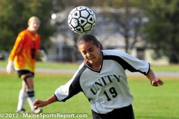 Unity’s McKinley Bell heads the ball during the first half of a game at Unity College on Friday. Unity won the women’s game over CMCC 2-0. (Photo Courtesy of Skip Hawkes)