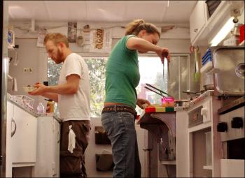 Sarah Waldron and Seth Whited, owners of Good 'n' You, side by side in the tiny kitchen.