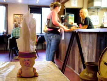A napkin holder makes a playful nod to the giver of pulled pork, ribs and other staple menu items at Pig Out BBQ, a southern-style barbecue restaurant that opened on Marshall Wharf in Belfast in July. (Photo by Ethan Andrews)