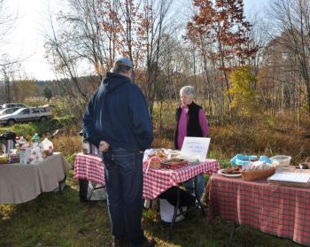 Roberta Heald works the bake sale table, raising funds for the ongoing Center School relocation and renovation project. (Photo courtesy Barbara Hatch)