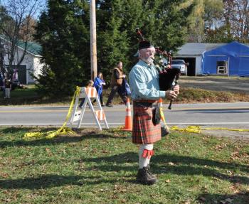 Ross Faneuf serenades with his bagpipe during the Center School's move Saturday. (Photo courtesy Barbara Hatch)