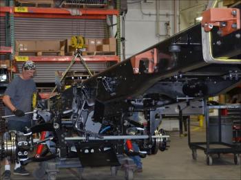 Assembly begins on the truck chassis, the fundamental steel core. (Photo by Lynda Clancy)