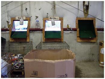 Chutes for recyclables, seen from inside the transfer station building, were recently rearranged. Several, including the one pictured at right, are being reserved for an expanded plastics collection program. (Photo by Ethan Andrews)