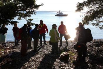 Saturday's volunteer victims receive a briefing on what to say and how to act when search and rescue crews pariticipating in the mass casualty exercise find them later in the morning. (Photo by Holly S. Edwards)