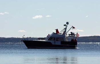 The Coast Guard Auxilliary vessel 'Dirigo Pilot' stands watch offshore Saturday morning. (Photo by Holly S. Edwards)