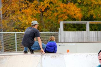 Skater Max Press and son Arlo watch the warmup.