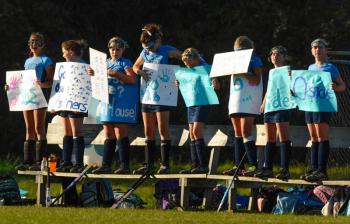 Oceanside reserves show support for their teammates during the game. (Photo by Ron Hawkes)