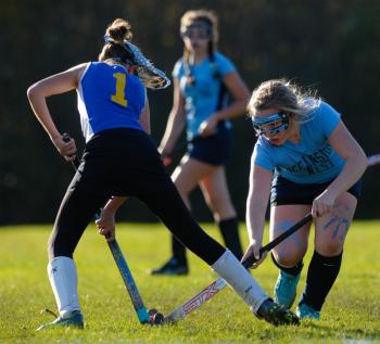 Troy Howard's Victoria Curtis stops Oceanside's Taylor Hamill as she tries to advance the ball. (Photo by Ron Hawkes)