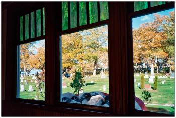 BELFAST - From the window of the chapel at Grove Cemetery at its reopening dedication. The 1917 building, unused since the 1960s, was restored by cemetery trustees. Trees planted by the Belfast Garden Club stand by mature trees from the original cemetery, many near the end of their lives.