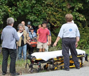 Maria Millard, who was rock-climbing in Camden, is carried off the mountain early Tuesday evening after falling approximately 60 feet down the side of a cliff while belaying. (Photo by Holly S. Edwards)