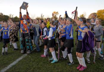 The Troy Howard players celebrate after receiving the Championship plaque from the Busline League field hockey championship. Troy Howard defeated Oceanside 1-0. (Photo by Ron Hawkes)