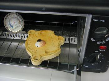 A prosthetic eye bakes in a toaster oven at Boston Ocular Prosthetics in Jackson. (Photo by Ethan Andrews)