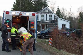 A 22-year-old car crash victim is loaded into a Camden First Aid Association ambulance on Slab City Road Monday afternoon. (Photo by Holly S. Edwards)
