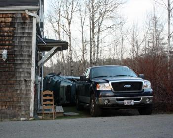 Ray Lovejoy's strategically-parked pickup truck did its job, blocking Monday afternoon's incoming car from crashing into his house. (Photo by Holly S. Edwards)