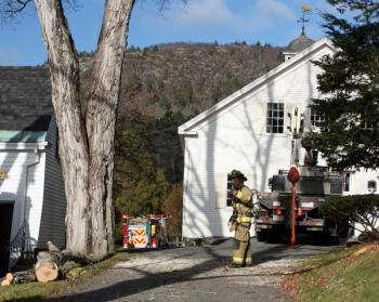 The residence at 26 High St. in Camden sits back off the road, behind a pair of homes. (Photo by Holly S. Edwards)
