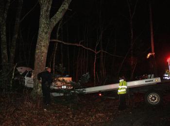 Camden Exxon begins removing the truck from the accident scene on outer Washington Street (Route 105) in Camden Friday. (Photo by Holly S. Edwards)
