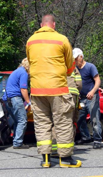 Turnout gear to fit 5-foot-7-inch-tall Justin Hills is expensive and when duty calls, like this car accident involving Nikki Gagne, one has overlook the obvious fashion faux pas. (Photo by Holly S. Edwards)