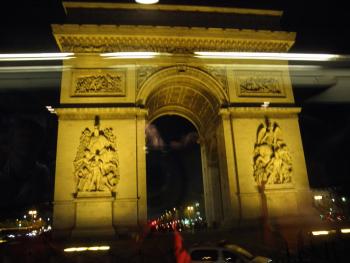 The Arc de Triomphe at night, from the bus.