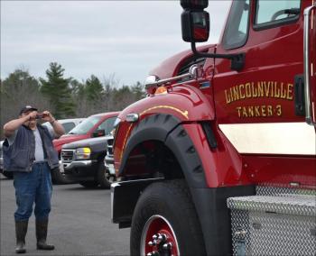 Hank Lang gets a few photos of the new tanker. (Photo by Lynda Clancy)
