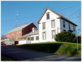 The old Waldo County Jail (brick building) and attached jailer's house — more recently the Sheriff's Office — were part of an unusual ownership maneuver the county hopes will allow the buildings to be sold on the open market. (Photo by Ethan Andrews)