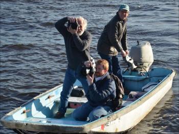 Photographers get their shots from off the dock.