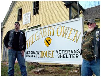 George Biagiotti, left, and Dwayne Keller, members of the Garry Owen Motorcycle Club, outside the new Garry Owen House. (Photo by Ethan Andrews)