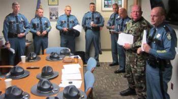Maine State Police Lt. Wes Hussey, far right, updates the contingent of troopers and deputies on their New Jersey assignment in the aftermath of Hurricane Sandy before they left Maine last Sunday. Standing next to Hussey is Cumberland County Sheriff's Sgt. Jim Ambrose, who also went to Louisiana seven years ago to assist after Hurricane Katrina. (Photo courtesy Maine State Police)