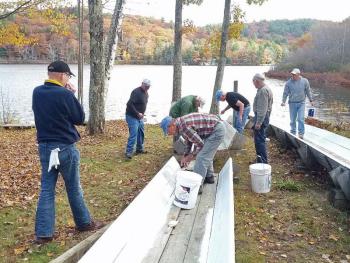 U.S. National Toboggan Championships Chute Master Stuart Young joined West Bay Rotarians at the Camden Snow Bowl for a chute-painting effort Oct. 26. Volunteering their time were Rotarians Sandy Cox, Mark Masterson, Rob Williams, George Forestall, Mike Moore, Bruce Bergen, Paul Rogers, and Tom Albertson. (Photo courtesy Sandy Cox)