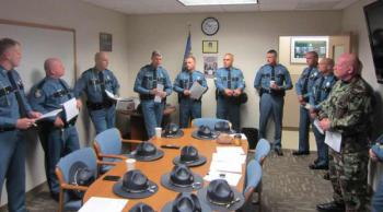 Maine State troopers and deputies will spend the eight days in New Jersey, along with troopers from Vermont and Maryland, to help restore order. Maine State Police Colonel Robert Williams, fourth from left, addresses the team.