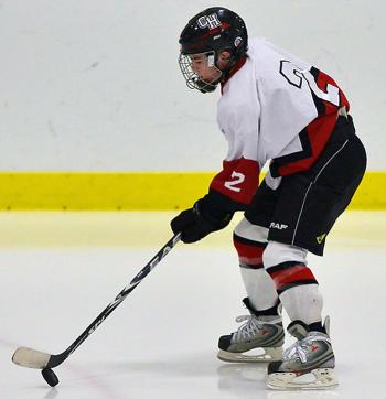 Camden Hills Nicholas Czuchra works with the puck during warmups. (Photo by Ron Hawkes)