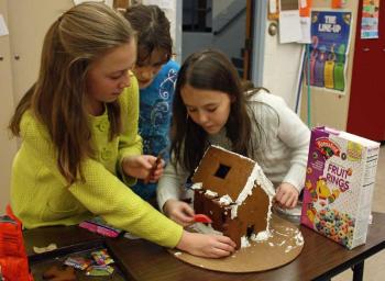 Temwork was required to both affix the decorations and determine what would go where. (Photo by Holly S. Edwards)
