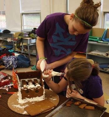 Gluing it together with royal icing, piece by piece. (Photo by Holly S. Edwards)