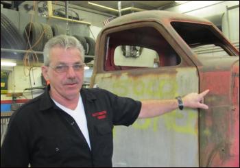 Larry Oakes next to his latest creation, a 1941 Studebaker complete with a custom frame (photo: Kay Stephens)