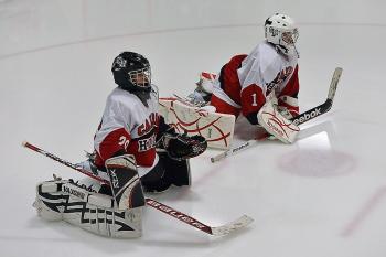 Camden Hills goalies, Zach Hand, left, and Jet Magri stretch before Saturday's contest with Hampden Academy. The Windjammers won 6-2 with Magri in goal. (Photo by Ron Hawkes)