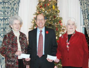 Mark Biscone, executive director of Waldo County General Hospital, is presented $6,000 in donations from Hospital Aid Treasurer Judy Whitney-Blake, left, and $3,000 from Lois Aiken, treasurer of the hospital's gift shop. (Photo courtesy Toni Mailloux)