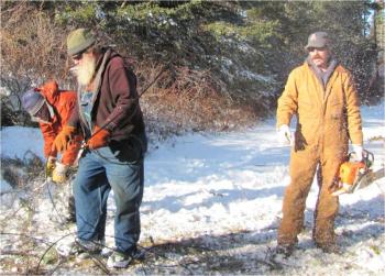 John Griffin, Paul Murray and Jeremy Van Dyne. The wire is a telephone line that had snapped off. (Photos by Eva Murray)