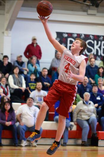 Cole Mills converts a lay up of a steal at half court. (Photo by Ron Hawkes)