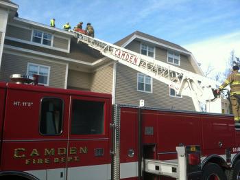 Due to the nature of the worker's knee injury, transport off the Quarry Hill roof with a ladder was deemed easier and safer. (Photo courtesy Justin Hills)