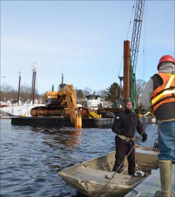 Toby Wincklhofer will dive beneath the tug to detangle line from a propeller with Jamie Dever taking him over to tug. (Photo by Lynda Clancy)