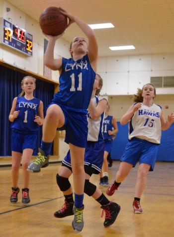Lincolnville's Izzy Lang goes up for a lay up for two points. (Photo by Ron Hawkes)
