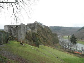 "The castle is perched on a wedge of cliff squeezed on either side by the ox-bowing Semois River."